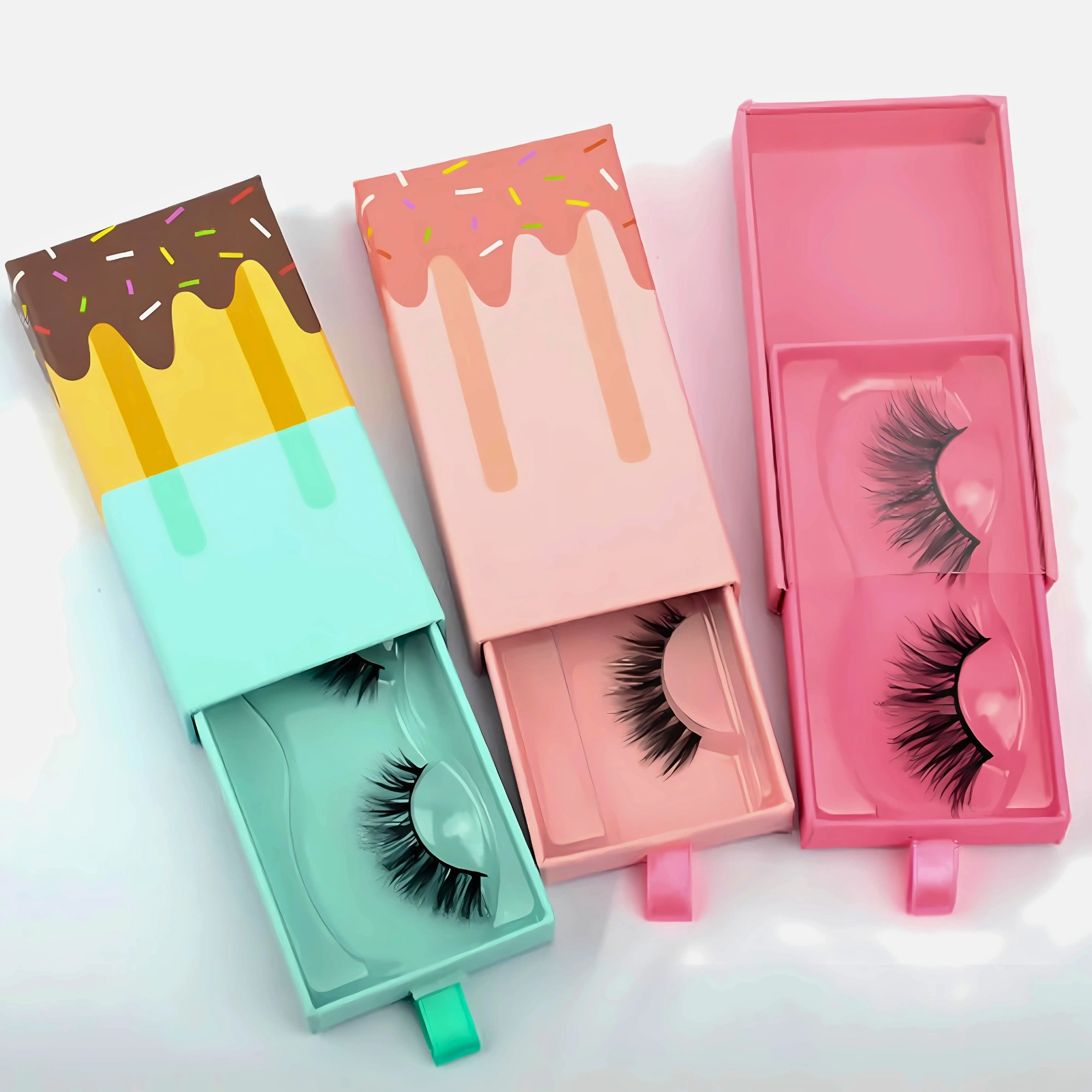Colorful eyelash boxes with lashes inside, showcasing fun designs.